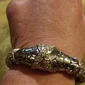 Silver bracelet snake like design with white gems